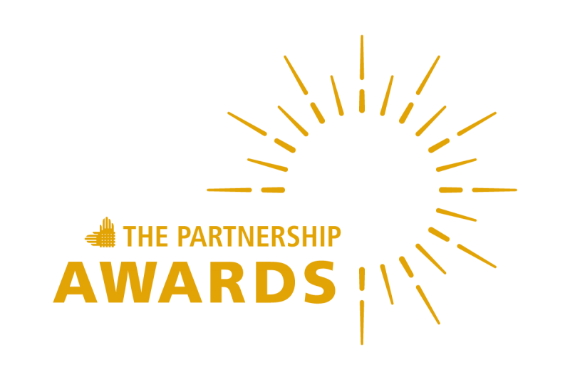 "THE PARTNERSHIP AWARDS" is shown next to an element of the Partnership's logo--intertwined hands. To the right is a large sunburst. All graphic elements are in goldenrod.