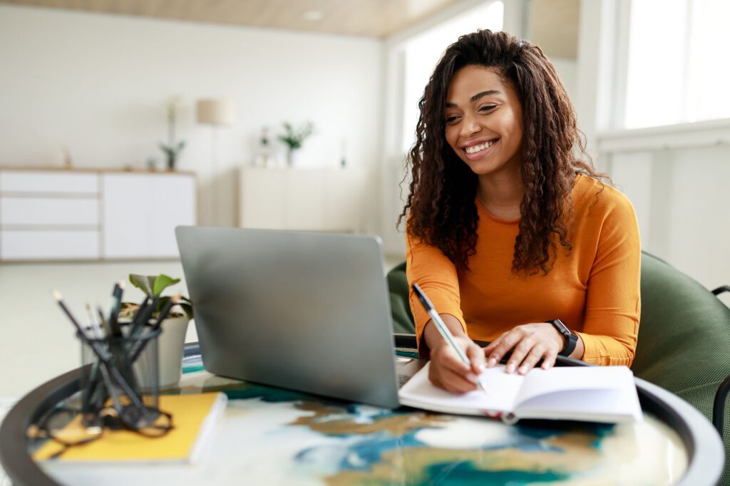 Woman sitting at her desk working on her computer