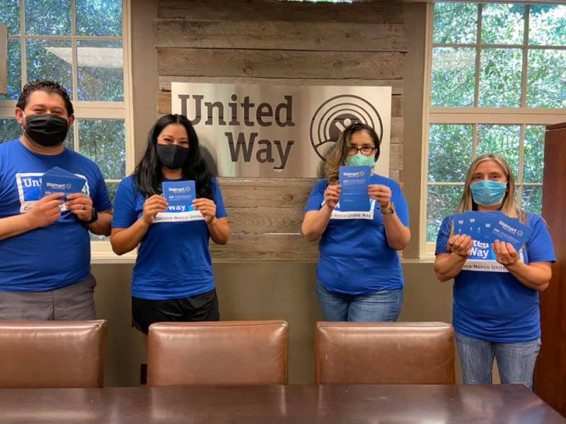 Photos of 4 people holding up walmart gift cards